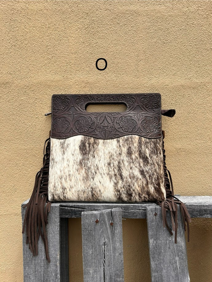 Cowhide and Coffee Brown tooled leather purse with fringe. This bag can be carried by the handle or the removable, adjustable strap. Front View O