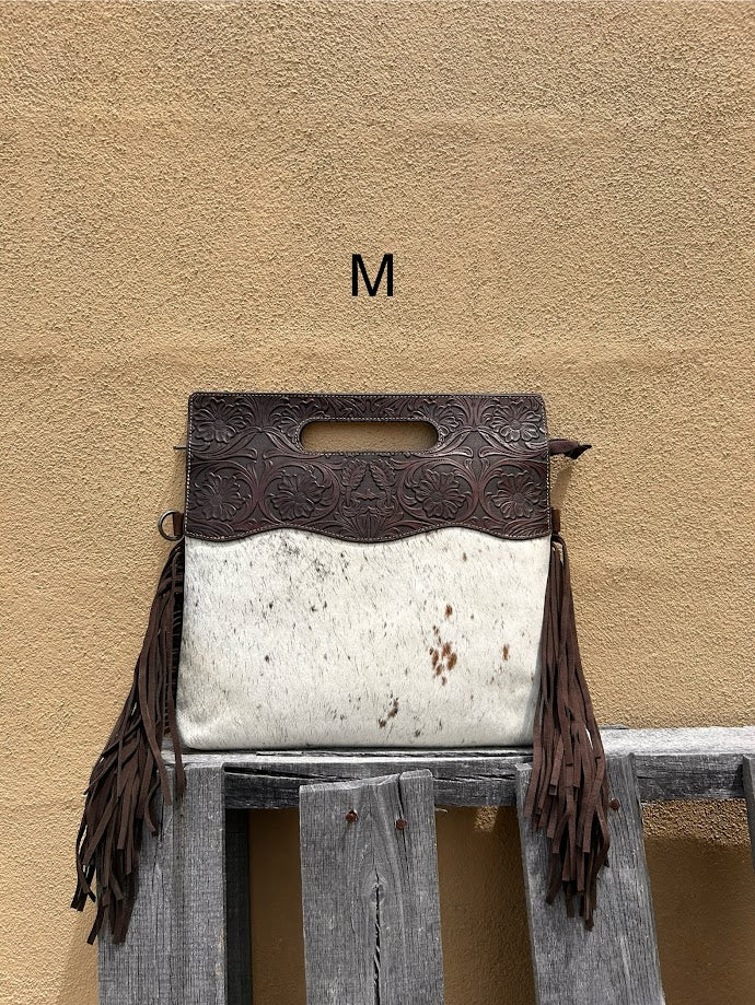 Cowhide and Coffee Brown tooled leather purse with fringe. This bag can be carried by the handle or the removable, adjustable strap. Front View M