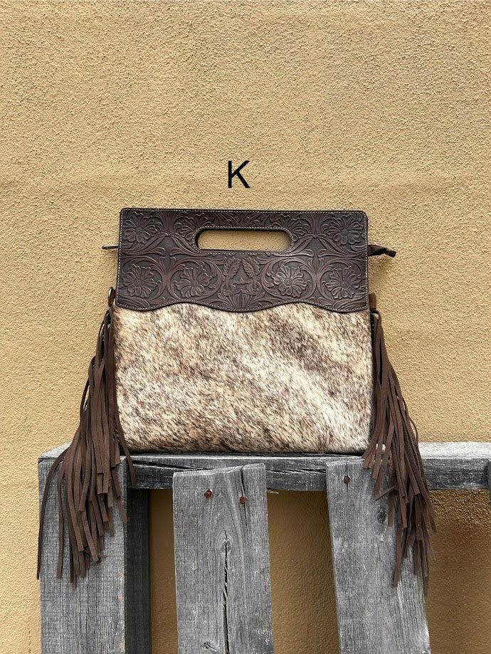 Cowhide and Coffee Brown tooled leather purse with fringe. This bag can be carried by the handle or the removable, adjustable strap. Front View K