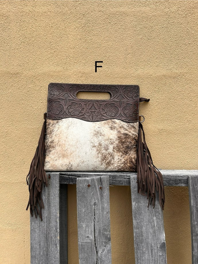 Cowhide and Coffee Brown tooled leather purse with fringe. This bag can be carried by the handle or the removable, adjustable strap. Front View F