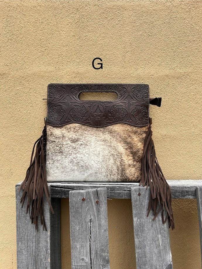 Cowhide and Coffee Brown tooled leather purse with fringe. This bag can be carried by the handle or the removable, adjustable strap. Front View G