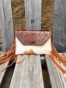 Cowhide purse with Brown leather embossed flap and tassel detail. Has a removable, adjustable shoulder strap and a wristlet strap. Front View P