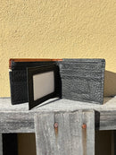 Black leather bifold wallet with Brown overlay and a Praying Cowboy Concho.  Inside view showing six card slots and two ID windows. 