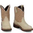 A profile view of a Pair of beige Justin Brand cowboy boots with brown accents on a white background.