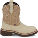 A side view of a beige Justin Brand cowboy boot with brown accents on a white background.