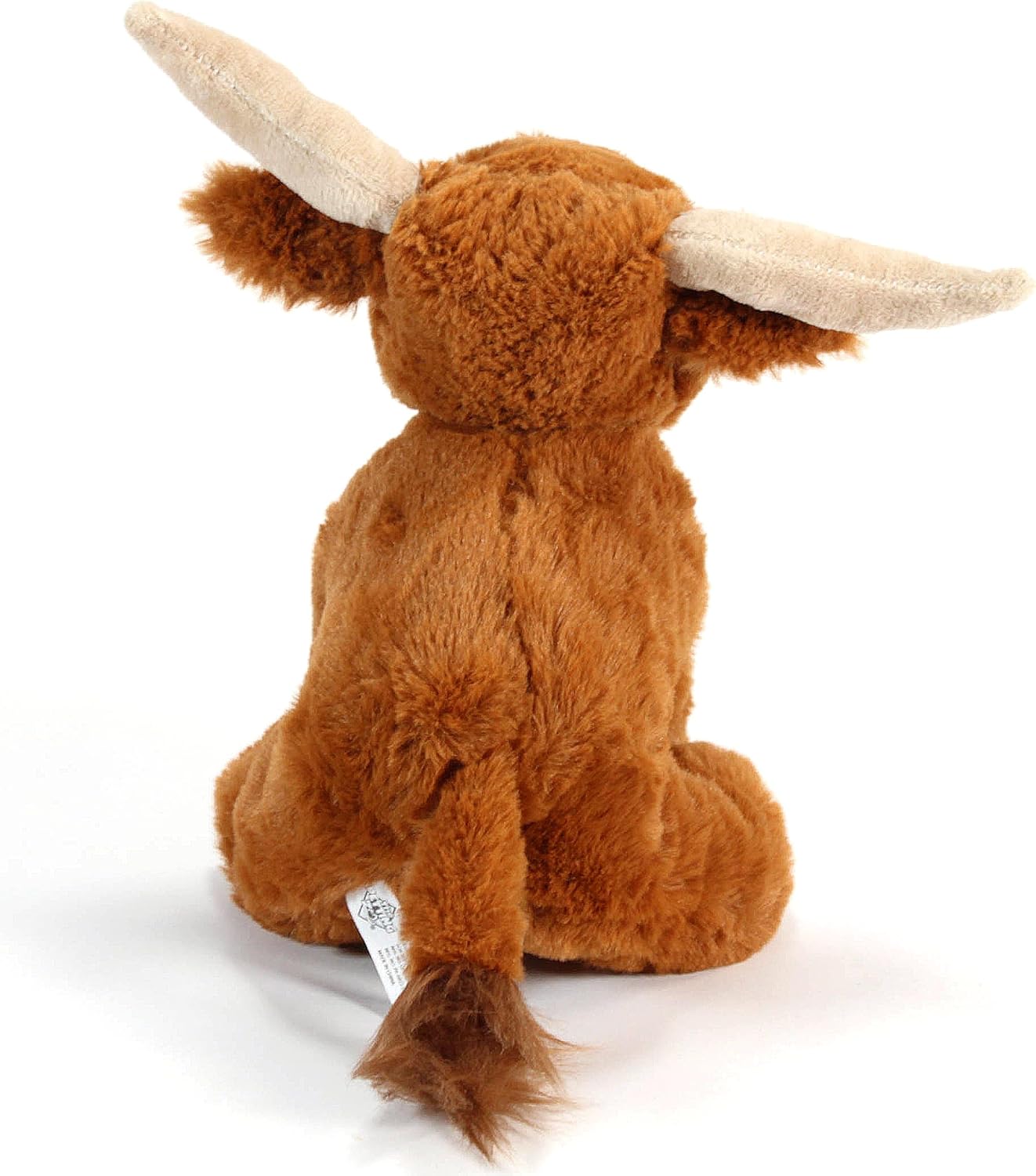 Back view of a plush toy seated longhorn cow with off white horns, red-brown body, and a light tan tail tassle.