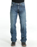 Men's White Label Medium Wash jeans front view showing detail of front pockets and zipper. Also shows relaxed  fit and stack on boots.