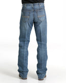 Men's White Label Medium Wash jeans back view showing detail of back pockets, belt loop placement, fit on seat and leg, stack on boots.