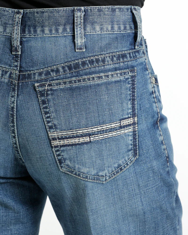 Close-up of back pocket stitching of Cinch White Label jeans.