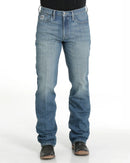 Men's Silver Label Medium Stone Wash jeans front view showing detail of front pockets and zipper. Also shows slim fit and straight leg on boots.