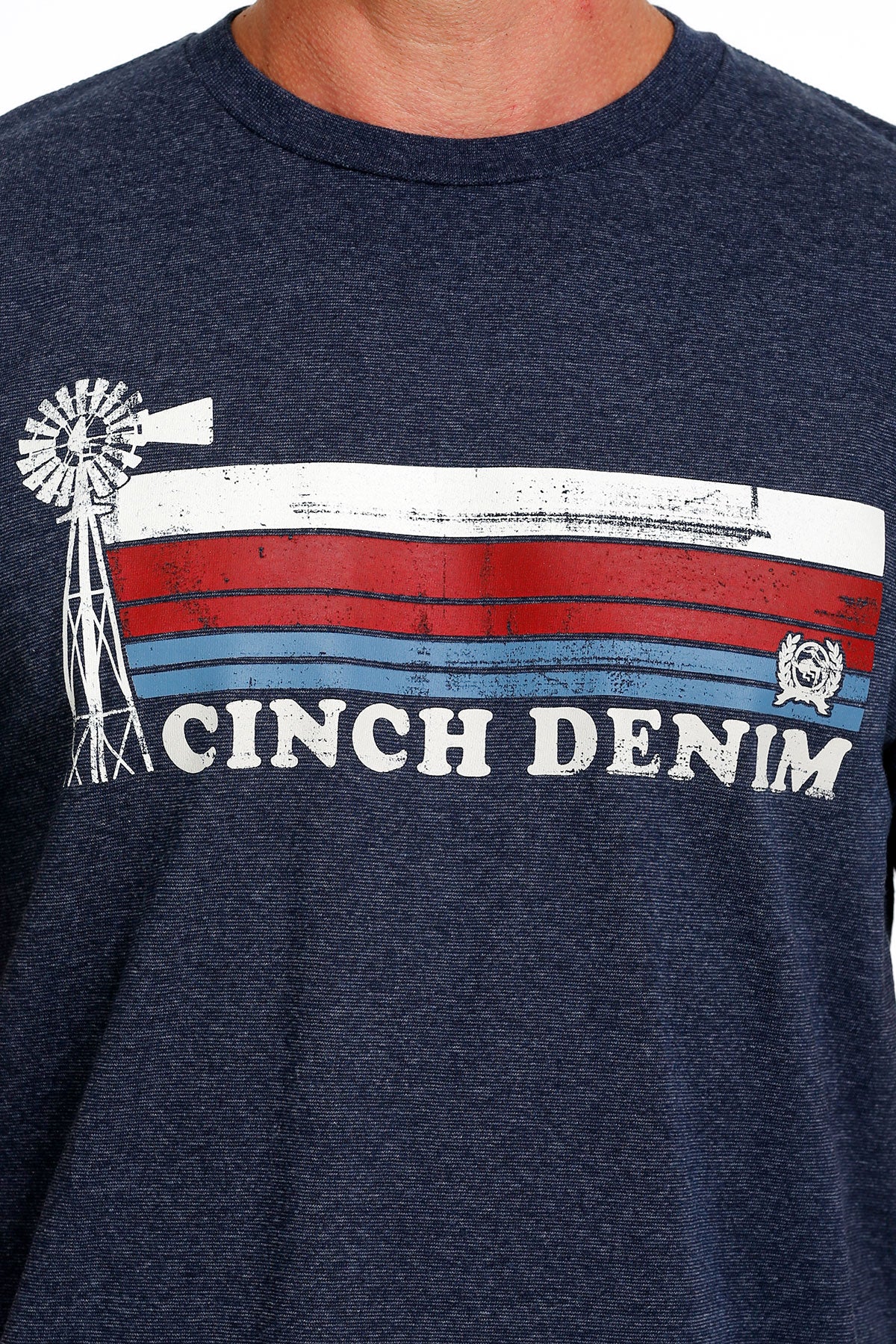 Men's navy Cinch crew neck tee with stripe screen print logo on chest. Close up front view.