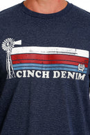 Men's navy Cinch crew neck tee with stripe screen print logo on chest. Close up front view.