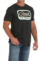 Men's black Cinch crew neck tee with screen print logo on chest. Front right view.