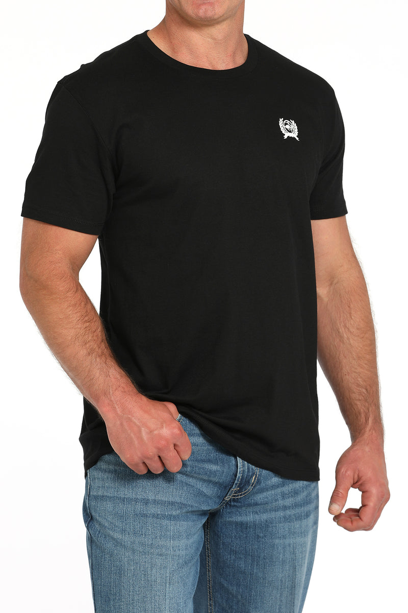 Men's Cinch black crew neck tee with screen print logo on chest. Front left view.