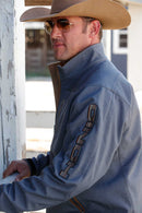 Lifestyle left side photo of Cinch blue logo jacket.