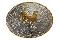 An oval-shaped western belt buckle with a standing rooster motif in antique gold and an engraved scrolling background in antique silver, with a rope edge in antique gold.