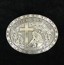 An oval-shaped western belt buckle featuring a design with a star pattern border, a kneeling soldier in the center with a cross, and the text 'FREEDOM IS NOT FREE'. Color: silver.