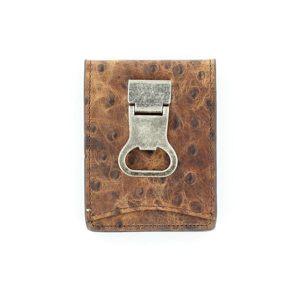 A brown Nocona ostrich print bifold money clip with a bottle cap money clip on the front, featuring a distressed leather texture and a metal clasp. Front view.