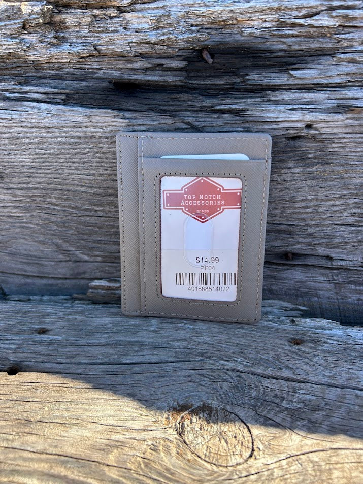 Gray leather wallet with a label on a wooden surface