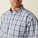 Men's Ariat Pro Series long sleeve shirt in Navy Red Plaid. Close up of button down collar showing Ariat logo and Ariat shield logo on right chest pocket. 