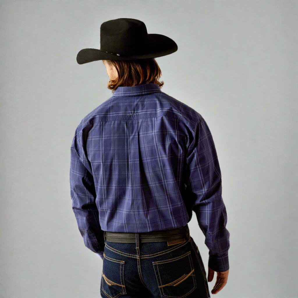 Men's Ariat long sleeve classic fit shirt in Navy. Rear view showing shirt tucked. 