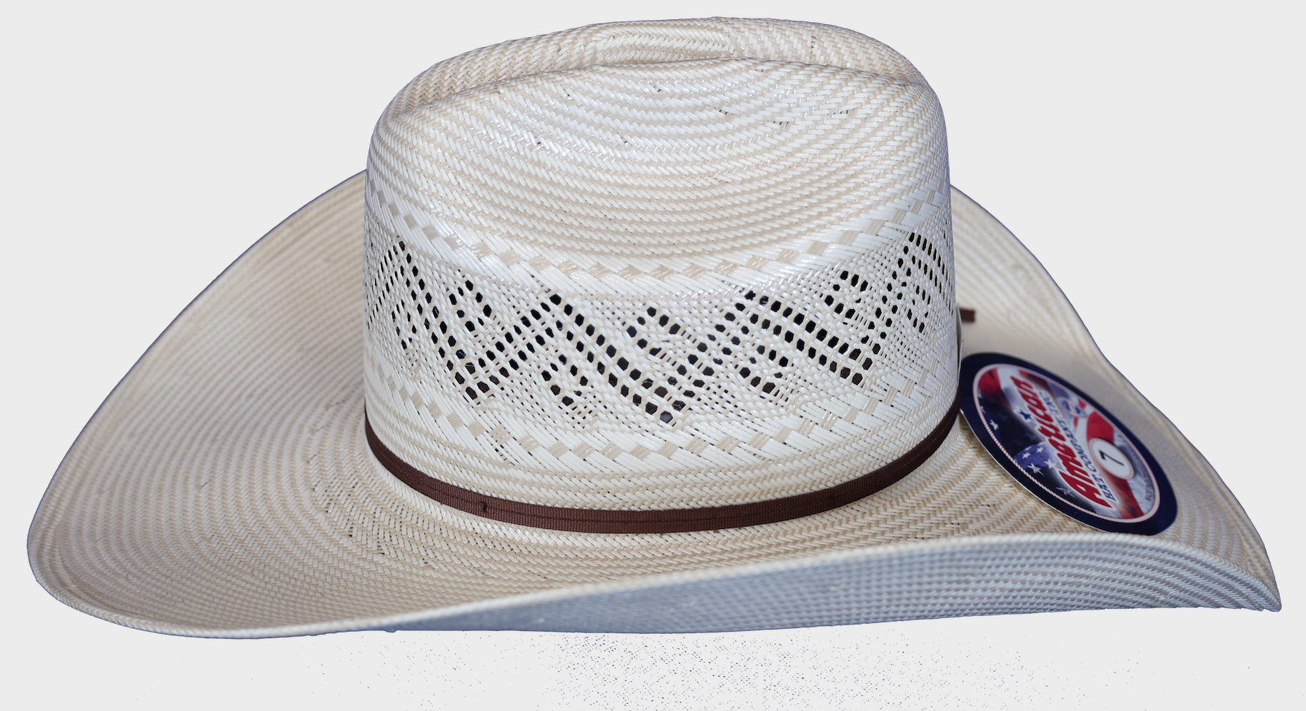 Straw cowboy hat with rancher crease, side view.