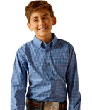 Boy's Ariat long sleeve Pro Series shirt in Blue Plaid. Front view showing shirt tucked in and stitched Ariat shield logo on left chest pocket. 