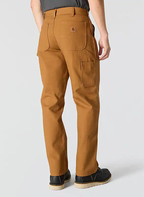 Mens Carhartt canvas work pants in Carhartt Brown. Rear view showing side cargo pocket. 