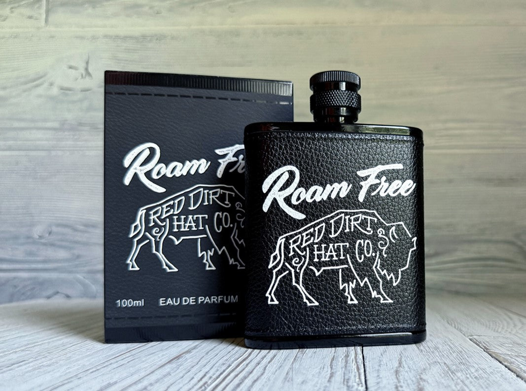 Men's Red Dirt Hat Co Roam Free cologne bottle, a black bottle shaped like a flask with a buffalo and Roam Free on the front. 
