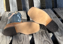 A pair of men's Anderson Bean 11 inch shaft distressed bison cowboy boots with blue kidskin tops and square toes. Bottom view showing Oxbow outsole. 