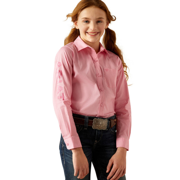 Girls Ariat long sleeve shirt in Prism Pink. This shirt has a bold Ariat logo on left sleeve. 