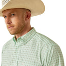 Men's Ariat long sleeve Team shirt in Light Green/White with a geometric print. Close up of Ariat logo on button down collar. 