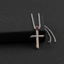 A two-tone (copper and antique silver) cross pendant on a stainless steel chain. Masculine. Front view.