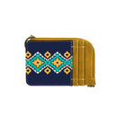 A mini zip card case with a southwestern art print, featuring a geometric pattern in mustard, white, and blue, combined with a Navy canvas body and PU leather accents.