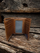 Brown alligator print leather trifold wallet with a Praying Cowboy Concho on a cowhide inlay. Inside view showing eight card slots and a ID window.