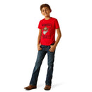 Boy's Ariat short sleeve tee in Red with a front "Wanted for Mischief" "The Ariat Kid" graphic print. Full front view showing shirt untucked. 