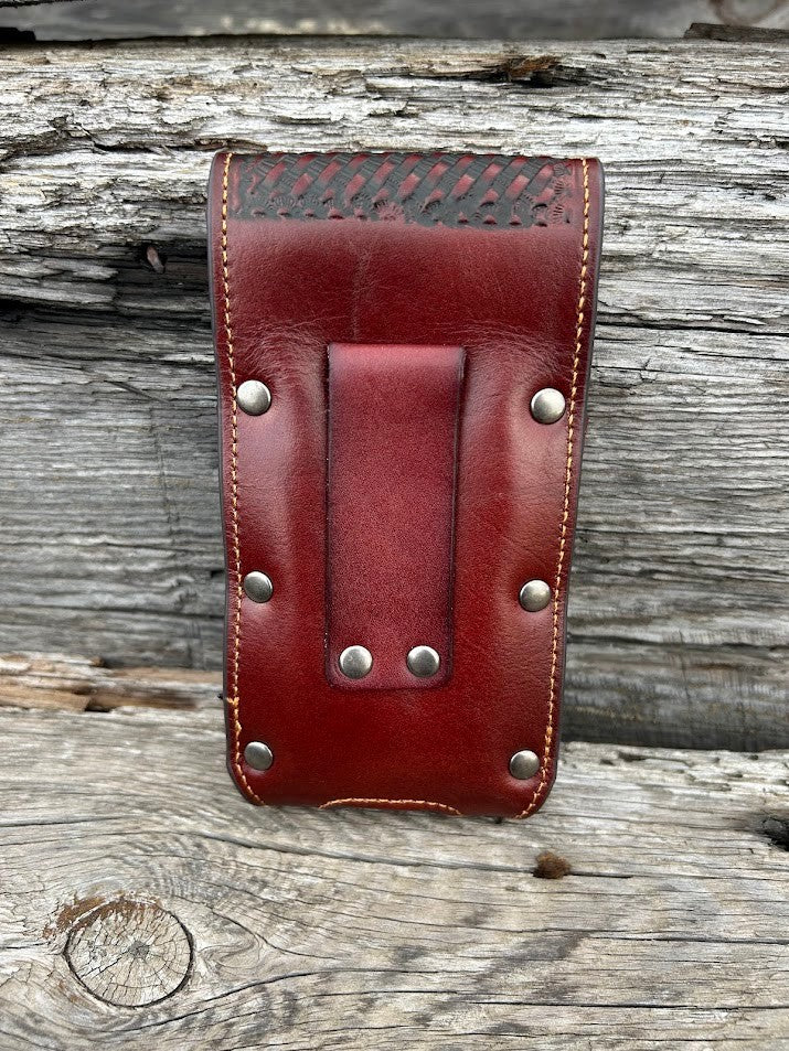 Brown basketweave leather phone case with embossed Praying Cowboy design as well as a Praying Cowboy Concho. Rear view showing leather belt loop. 