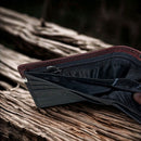 Black leather bifold wallet with Brown overlay and a Longhorn Concho. Dual cash slot views showing zippered pocket. 