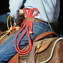 Photo showing roper with jerk line hooked under the side of his belt and attached toward his curb strap.