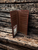 Brown tooled leather tall wallet with Beige inlay. Inside view of multiple card and bill slots. 