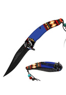 This Blue spring assisted knife features a Native American design. 