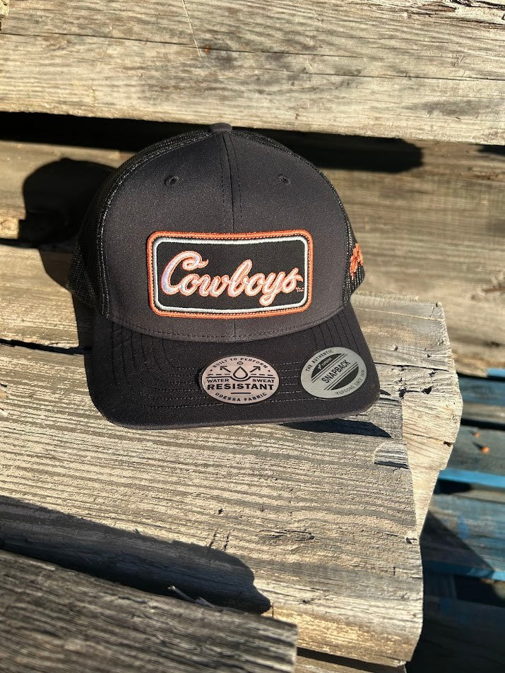 Hooey x Oklahoma State University Cowboys Black 6 panel snapback trucker cap with mesh back. Features a Cowboys patch on front and a small Hooey logo on side. Front view outside photo. 