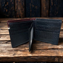 Black leather bifold wallet with Brown overlay and a Longhorn Concho. Inside view showing six card slots and two ID windows. 