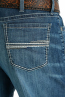 Close-up of back pocket stitching of Cinch White Label jeans.