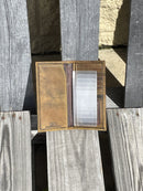 The tall secretary design provides ample space for cards, ID, and cash, while the leather gives it a natural appearance. Inside view showing 6 interior credit card slots
ID window
1 plastic (6 card insert)
2 bill/cash compartment