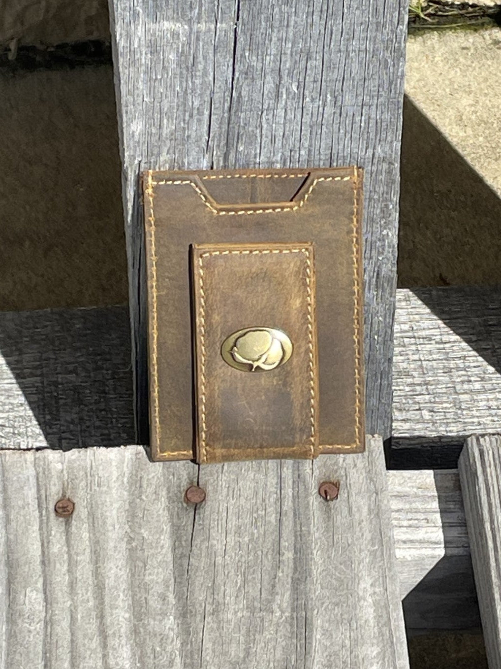 Zep Pro Brass Cotton Concho Vintage Tan Leather Front Pocket Wallet. Front view shows Cotton boll concho on money clip tab.