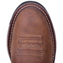 A toe view of a brown, leather men's work Dan Post boot with a round toe and a 11-inch shaft height. It features a rubber outsole and a removable orthotic.