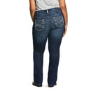 Women's Ariat mid rise boot cut jean in Marine which is a medium wash. Rear view on model.