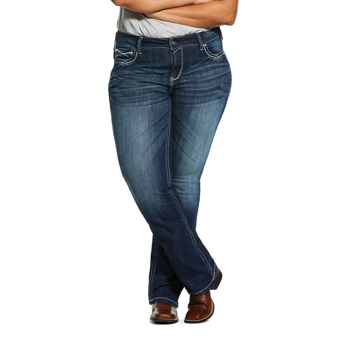 Women's Ariat mid rise boot cut jean in Marine which is a medium wash. Front view showing jeans on model. 