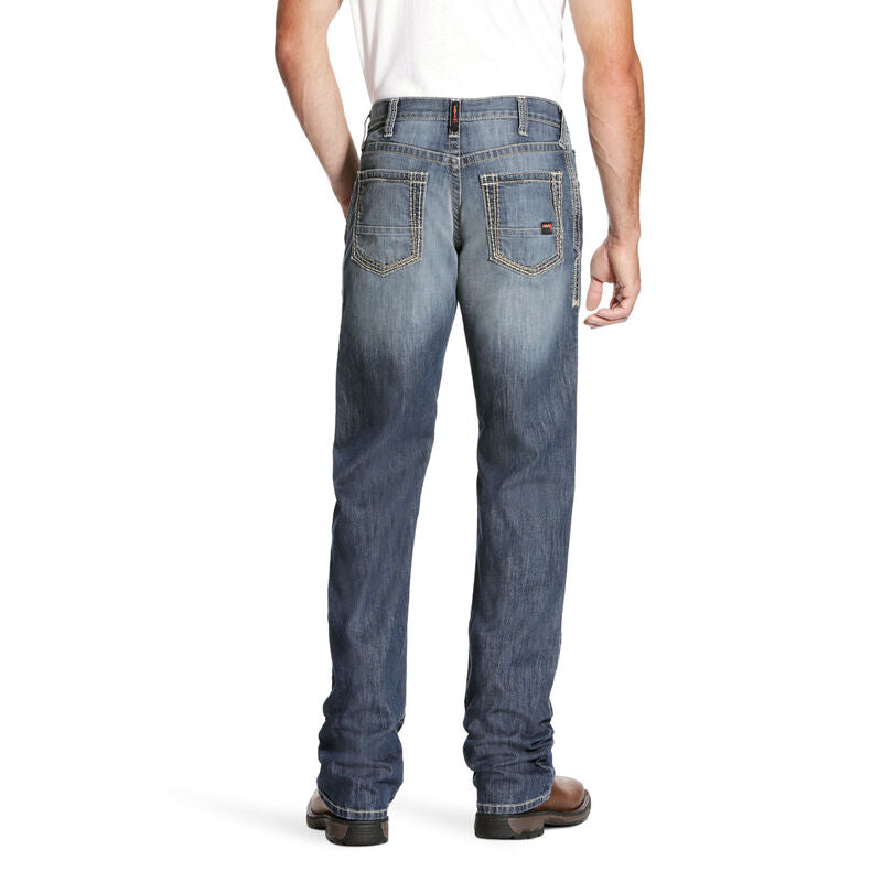 Men's Ariat FR jeans in a M4 relaxed fit boot cut. Rear View